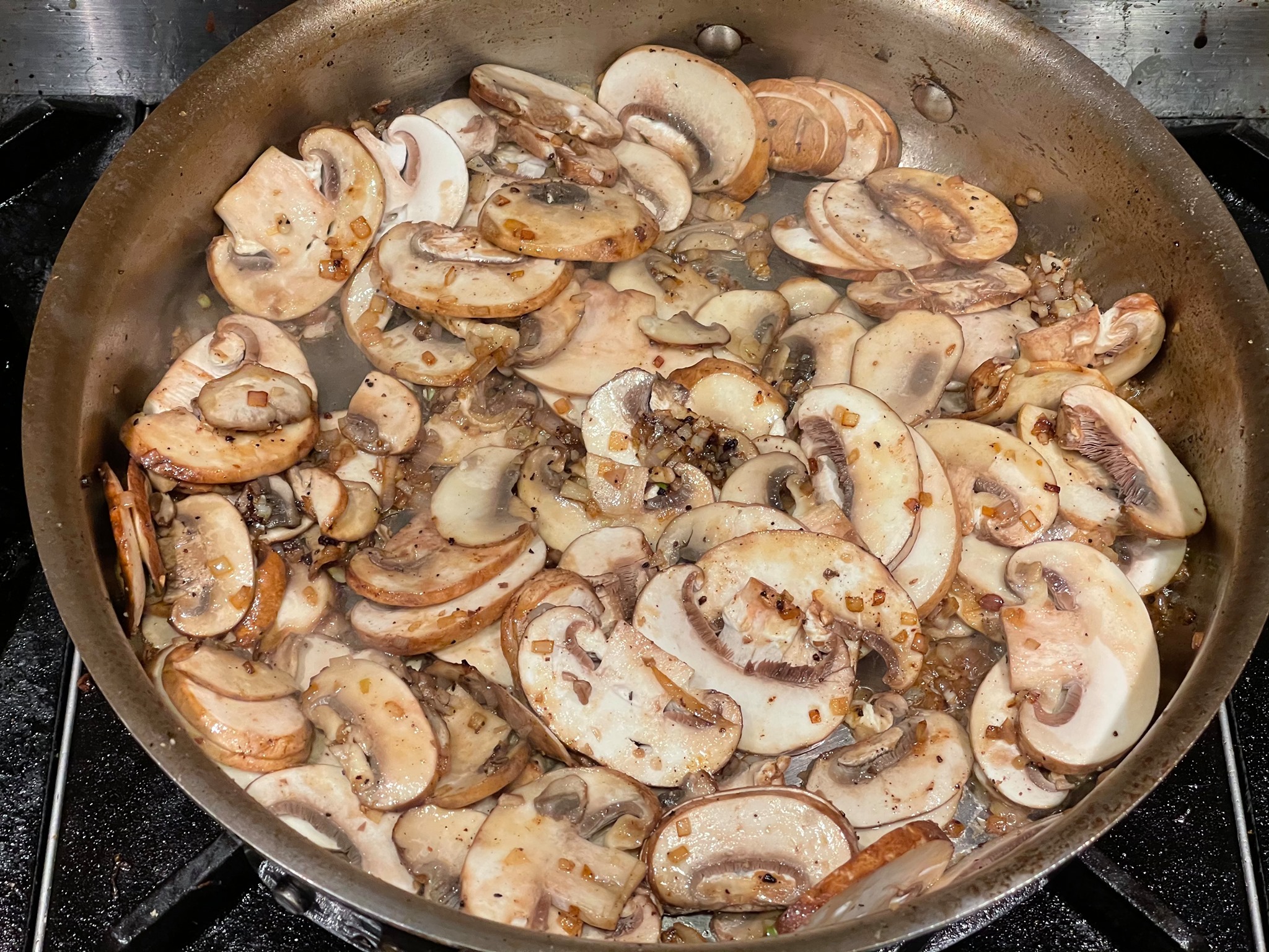 Mmmm, flambéing the Steak Diane sauce