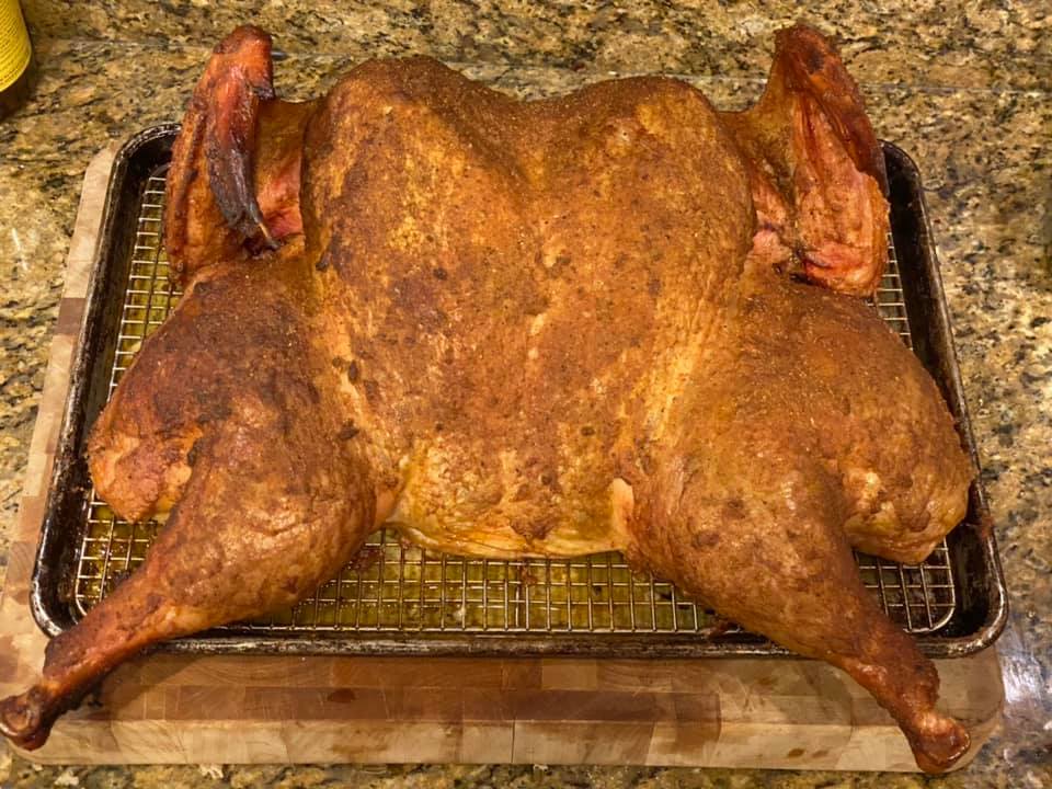 Pulled the turkey from the smoker and put it under tented tinfoil t