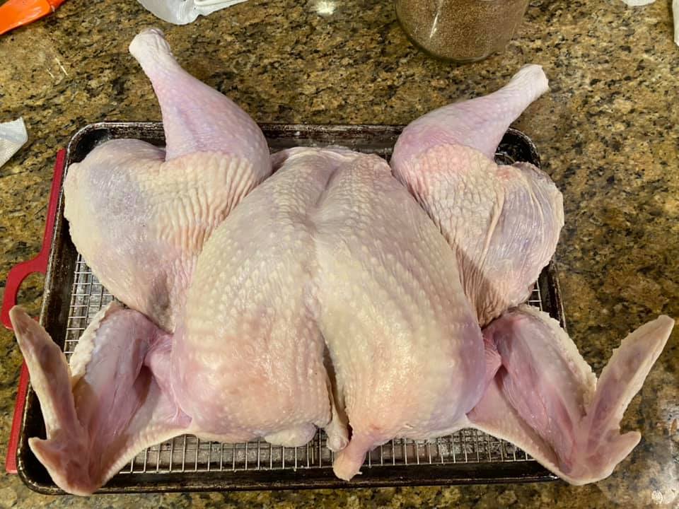Stuffing the turkey that had its skin dried for two hours with th